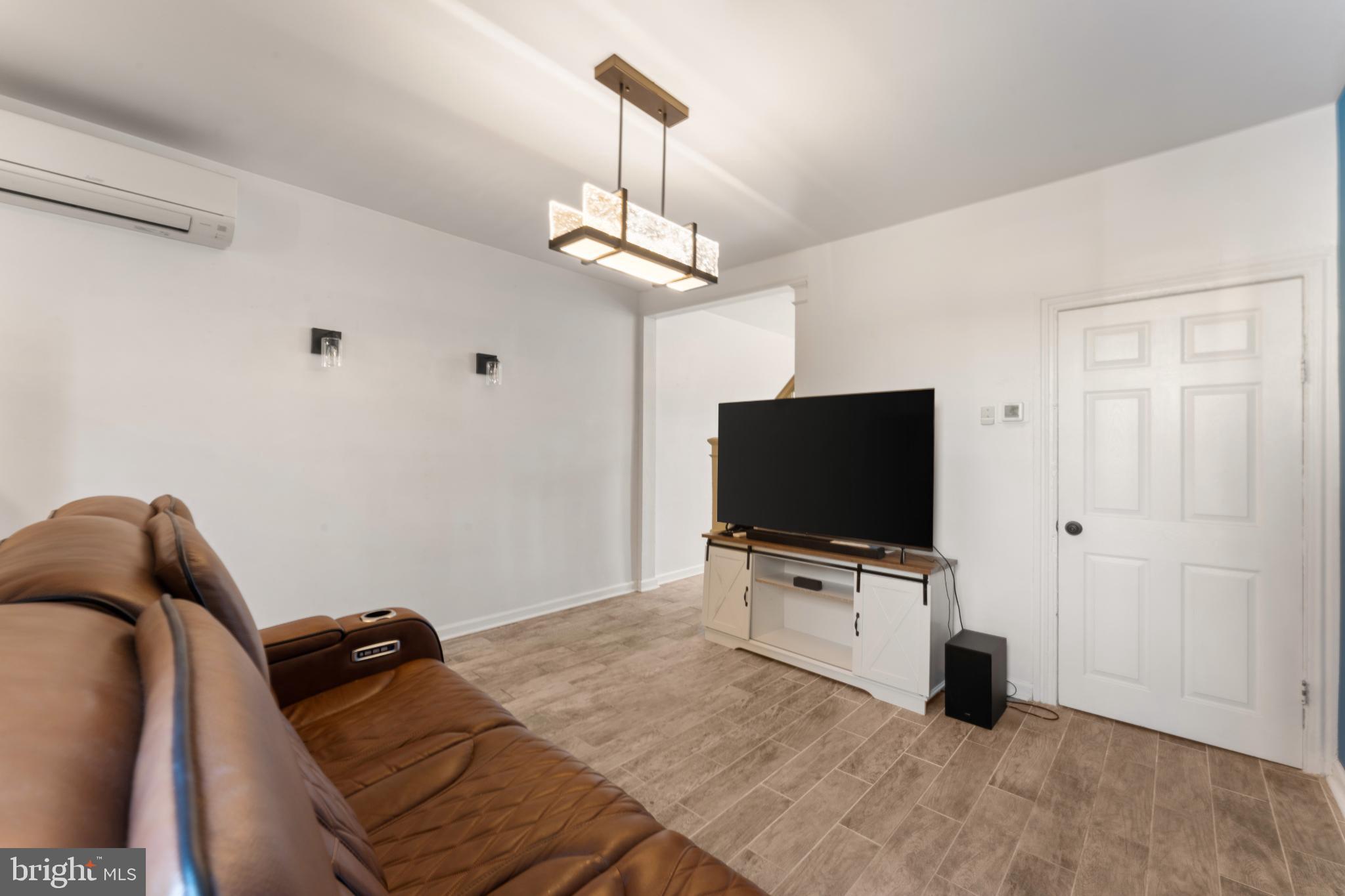 4618 Smick Street Philadelphia, PA 19127 - Photo 7 of 32 a bedroom with a bed and flat screen tv