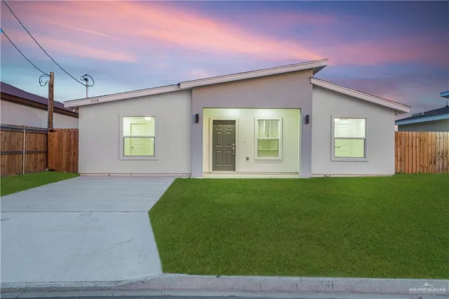 a view of a livingroom with a kitchen