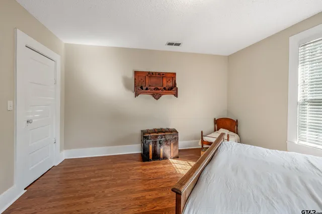 a bed room with a bed and a window