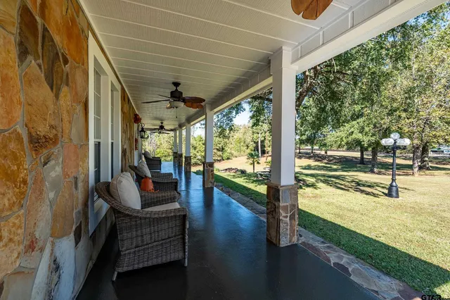 a view of swimming pool with a patio