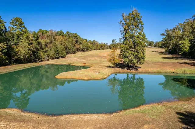 a view of a lake with a yard