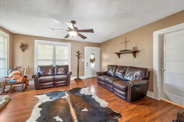 a living room with furniture and a large window