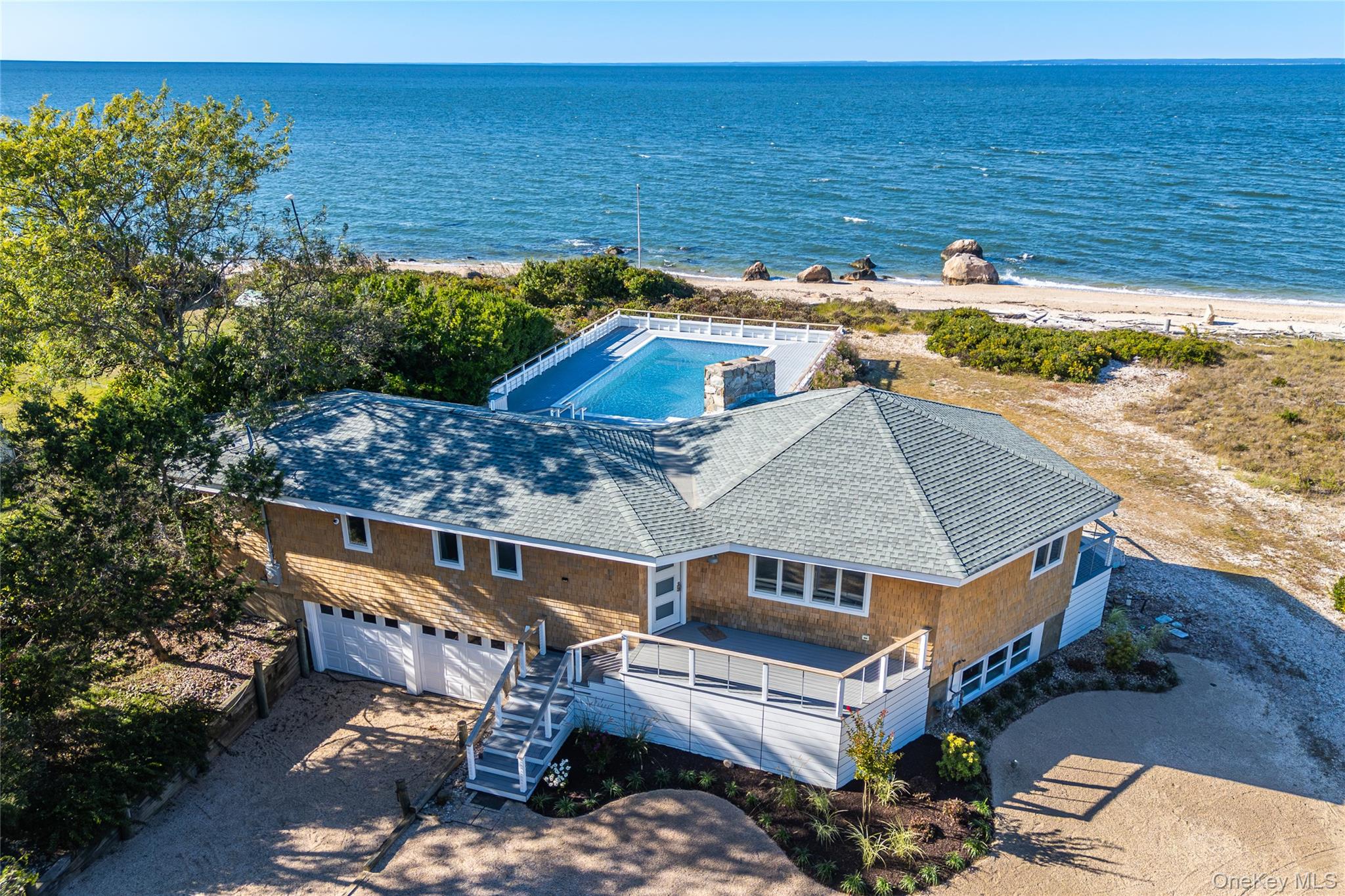 a aerial view of a house with a ocean view
