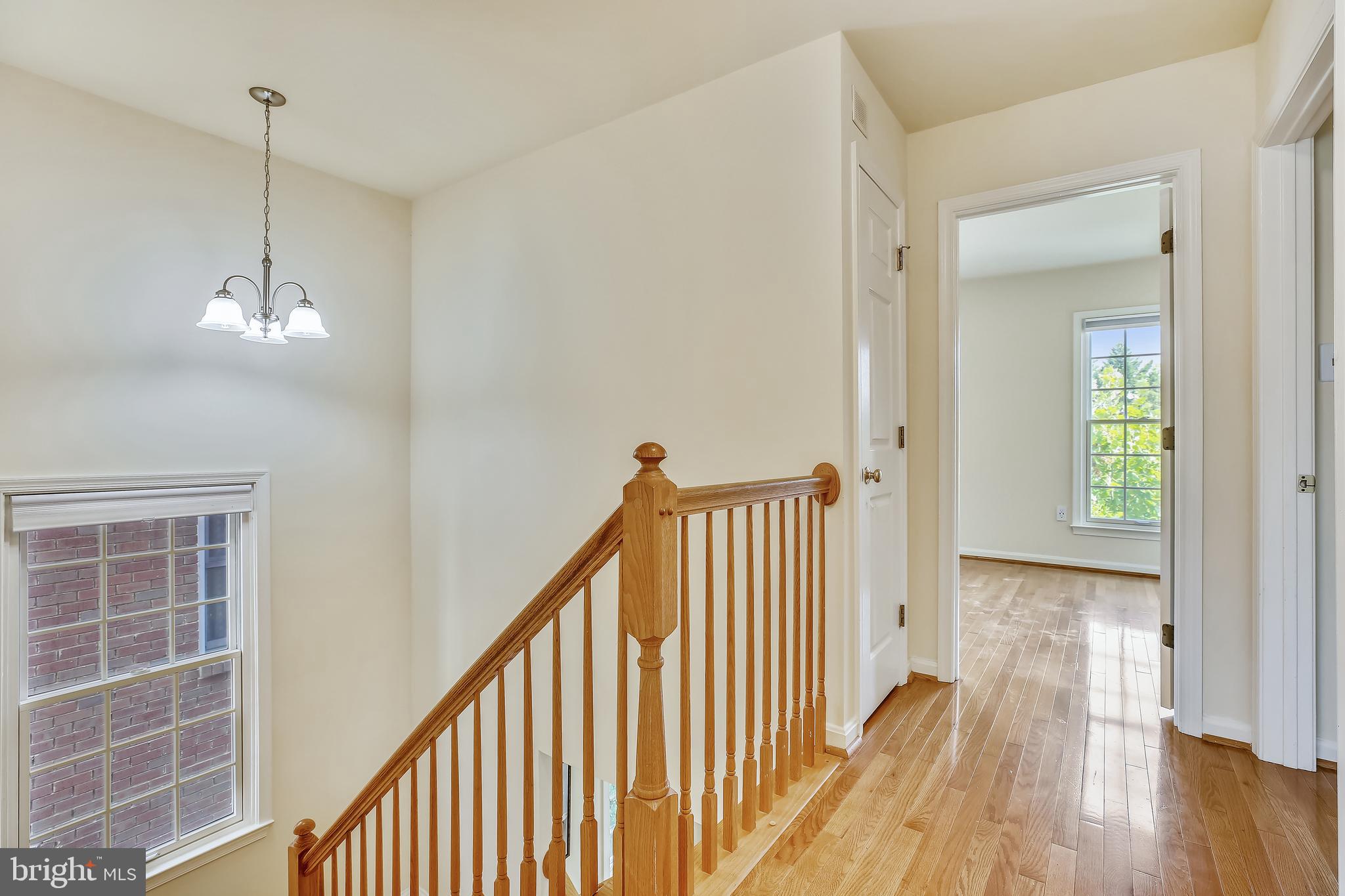 520 Tschiffely Square Road Gaithersburg, MD 20878 - Photo 25 of 39 Upper level hallway with hardwood flooring