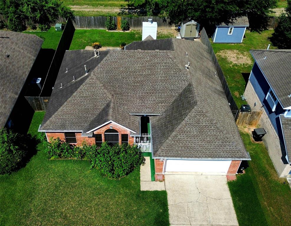 13618 Sablegrove Lane Houston, TX 77014 - Photo 2 of 30 an aerial view of a house with a yard and table and chairs