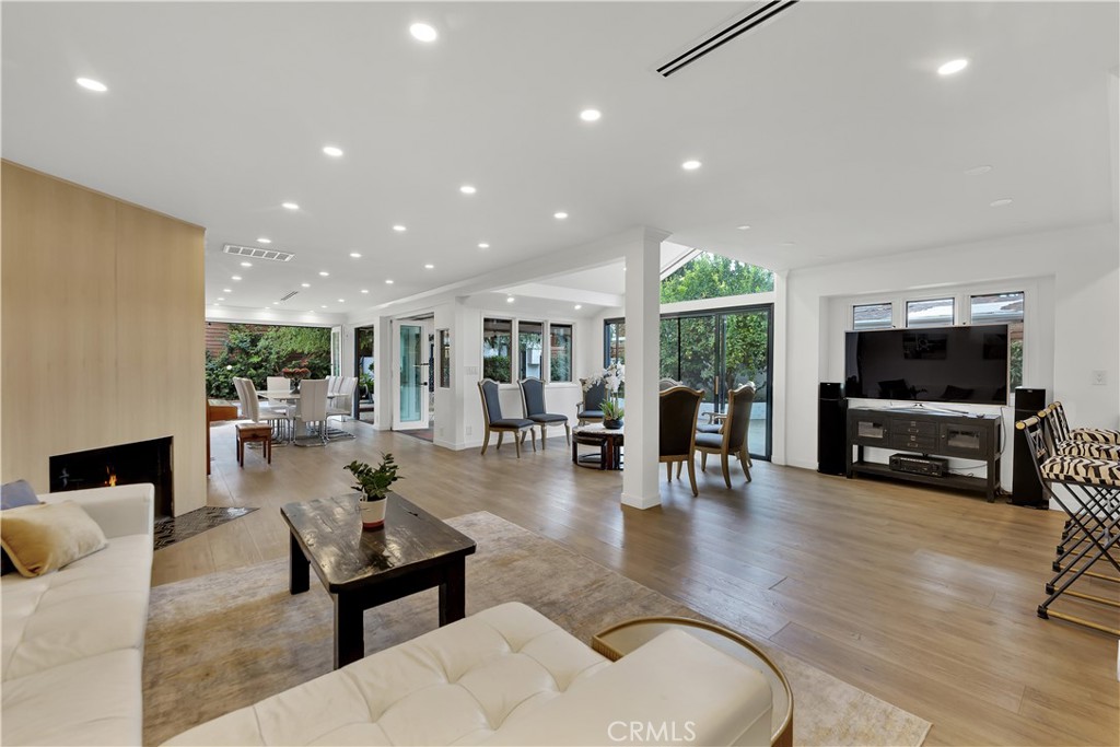 a living room with fireplace furniture and a flat screen tv