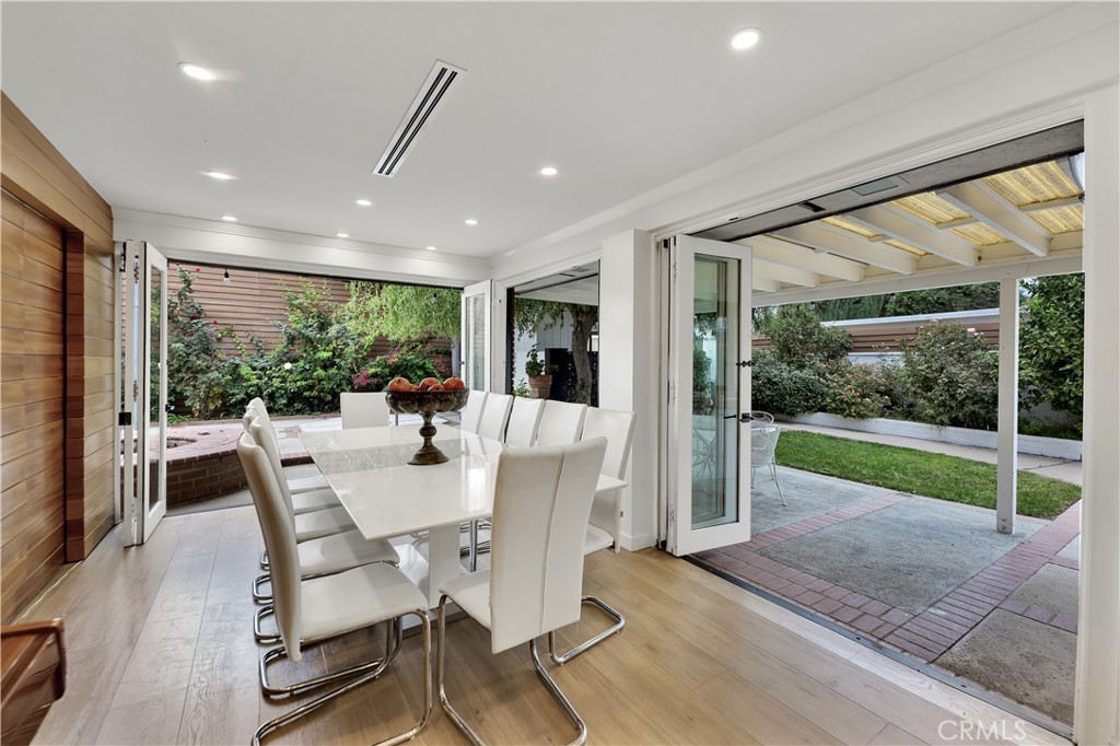 6409 Graves Avenue Lake Balboa, CA 91406 - Photo 11 of 50 a view of a dining room with furniture wooden floor and garden view