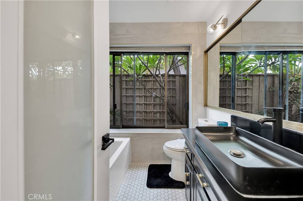 6409 Graves Avenue Lake Balboa, CA 91406 - Photo 18 of 50 a room with a large window and a table chair