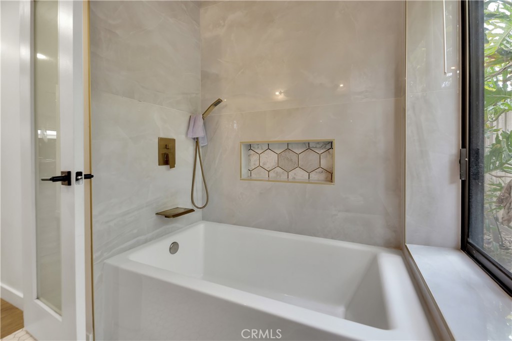 6409 Graves Avenue Lake Balboa, CA 91406 - Photo 19 of 50 a bath tub sitting next to a white sink