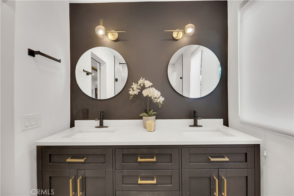 6409 Graves Avenue Lake Balboa, CA 91406 - Photo 22 of 50 a bathroom with a sink and a mirror