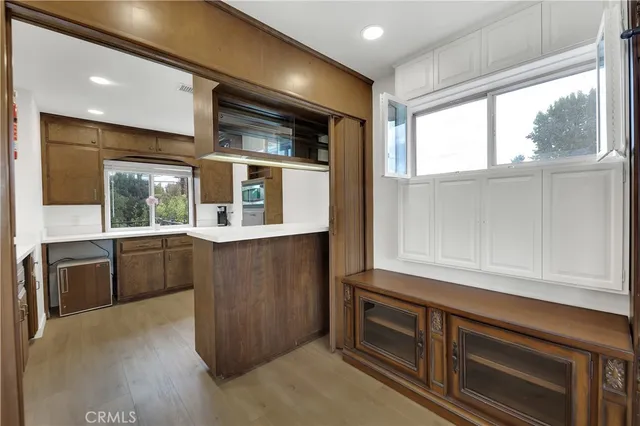 a kitchen with stainless steel appliances granite countertop a stove and a wooden cabinets