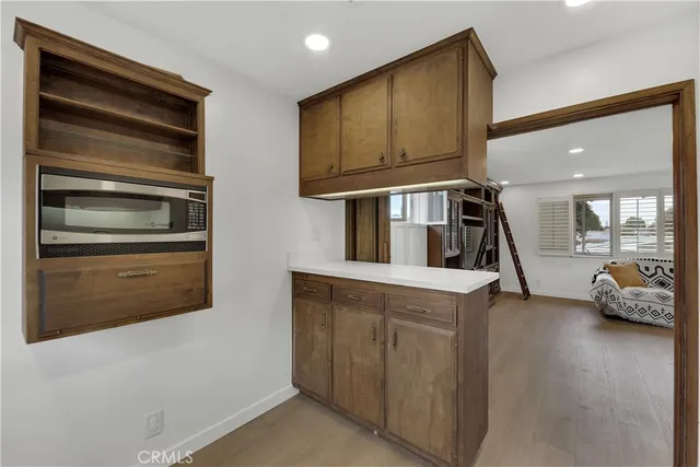 a kitchen with stainless steel appliances granite countertop a stove and a refrigerator