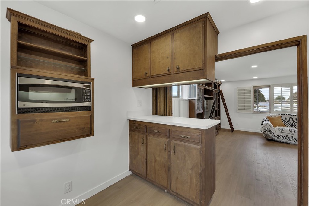 6409 Graves Avenue Lake Balboa, CA 91406 - Photo 32 of 50 a kitchen with stainless steel appliances granite countertop a stove and a refrigerator