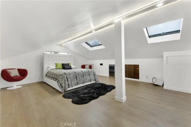 a bedroom with a bed and a cabinets