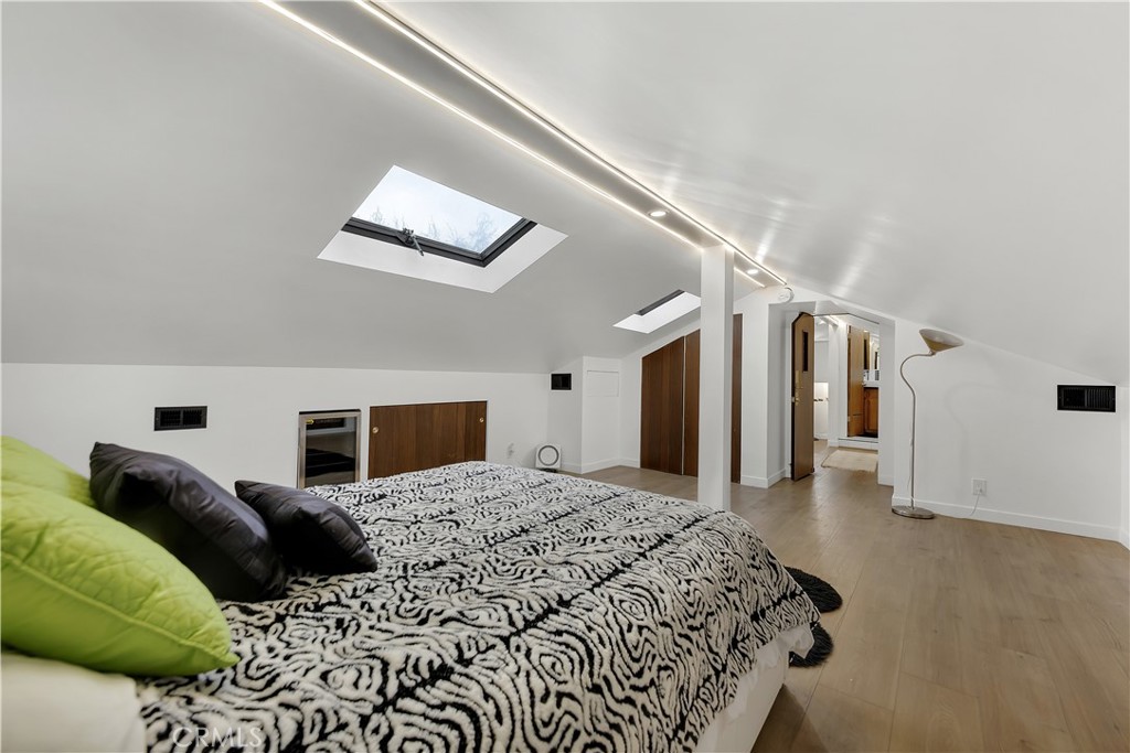 6409 Graves Avenue Lake Balboa, CA 91406 - Photo 36 of 50 a bedroom with a large bed and a couch