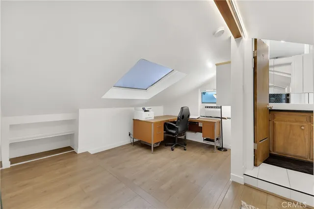 a view of a livingroom with furniture and a window