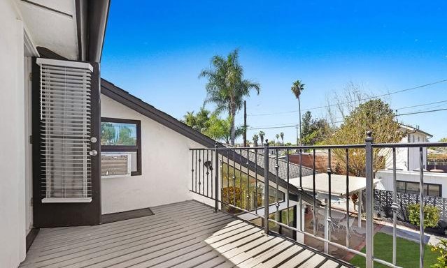 6409 Graves Avenue Lake Balboa, CA 91406 - Photo 39 of 50 a view of a balcony with wooden floor and fence