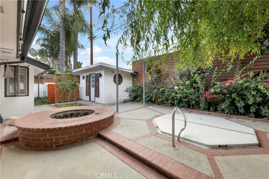 6409 Graves Avenue Lake Balboa, CA 91406 - Photo 43 of 50 a wooden bench sitting in front of a building