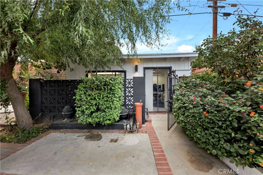6409 Graves Avenue Lake Balboa, CA 91406 - Photo 44 of 50 a view of a entryway door with plants in front of house