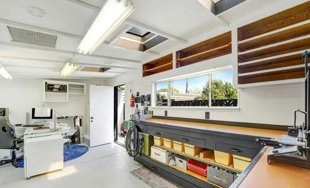 a room with furniture pool table and flat screen tv