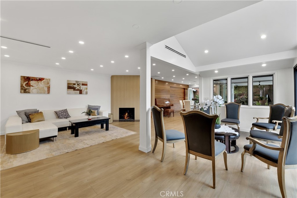 6409 Graves Avenue Lake Balboa, CA 91406 - Photo 8 of 50 a living room with furniture a dining table and chairs with kitchen view