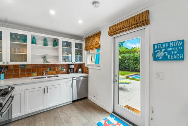 a kitchen with a sink and cabinets