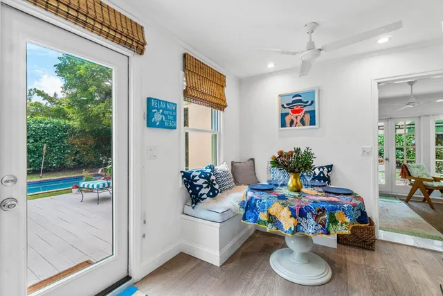 a play room with furniture and a floor to ceiling window