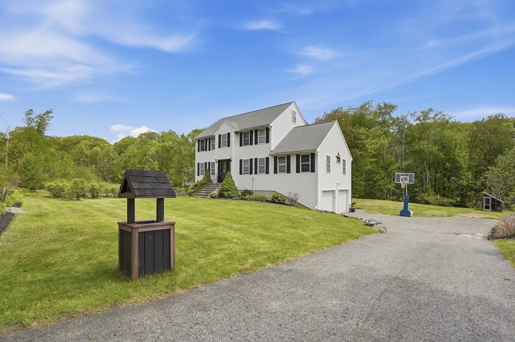 160 Gray Road Templeton, MA 01468 - Photo 36 of 42 a front view of a house with a yard and trees