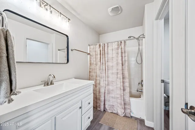 a bathroom with a sink double vanity and shower