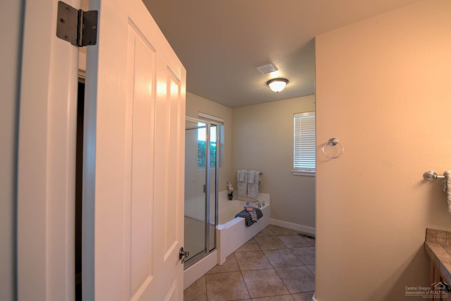 61915 Fall Creek Loop Bend, OR 97702 - Photo 12 of 24 The main level master bathroom includes