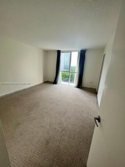 600 Grapetree Drive, Unit 6ES Key Biscayne, FL 33149 - Photo 13 of 21 an empty room with windows