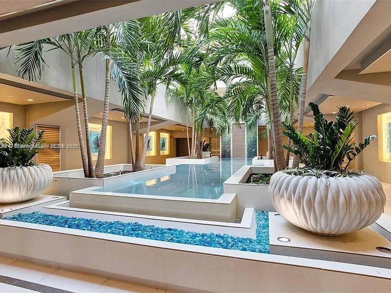 600 Grapetree Drive, Unit 6ES Key Biscayne, FL 33149 - Photo 18 of 21 a view of a couches in a patio