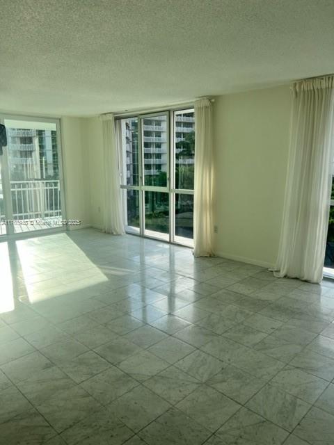 600 Grapetree Drive, Unit 6ES Key Biscayne, FL 33149 - Photo 6 of 21 an empty room with windows