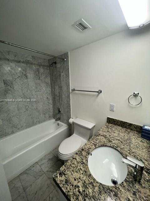 600 Grapetree Drive, Unit 6ES Key Biscayne, FL 33149 - Photo 10 of 21 a bathroom with a granite countertop toilet a sink and bathtub