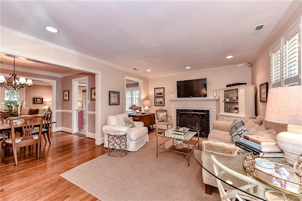 1028 Sedgefield Road Charlotte, NC 28209 - Photo 2 of 24 a living room with furniture a fireplace and a flat screen tv