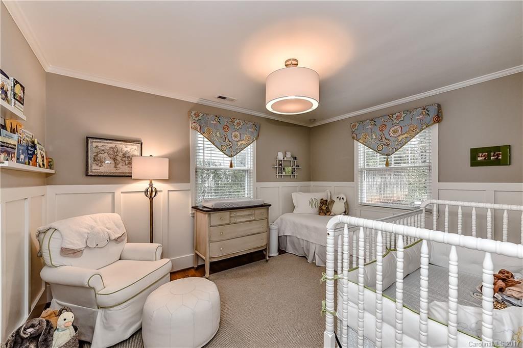 1028 Sedgefield Road Charlotte, NC 28209 - Photo 15 of 24 a bedroom with furniture and a wooden floor