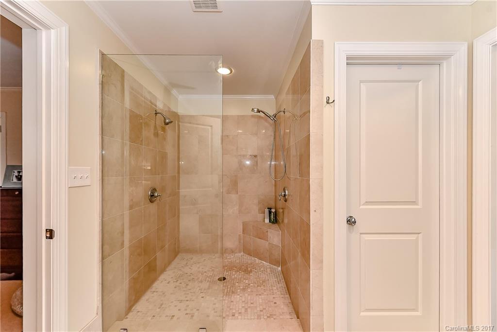 1028 Sedgefield Road Charlotte, NC 28209 - Photo 19 of 24 a bathroom with a shower and a sink