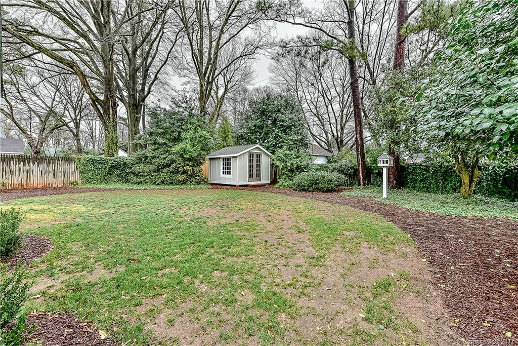 1028 Sedgefield Road Charlotte, NC 28209 - Photo 23 of 24 a house with trees in front of it