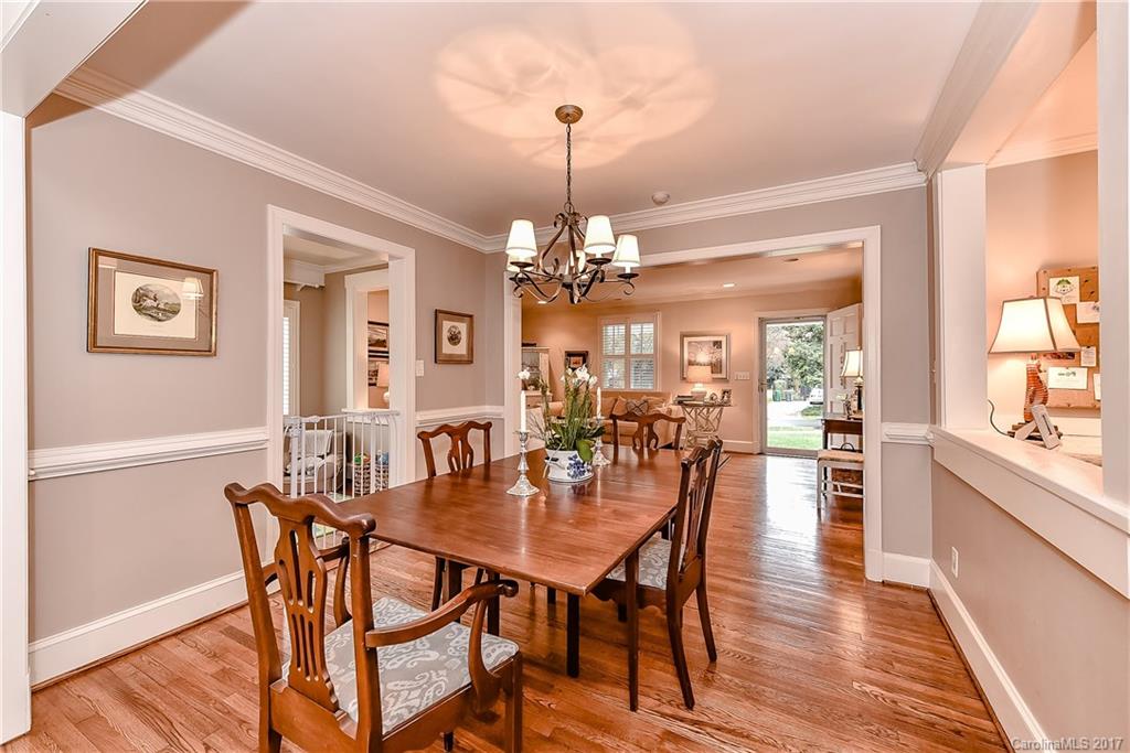 1028 Sedgefield Road Charlotte, NC 28209 - Photo 10 of 24 a view of a dining room with furniture window and wooden floor