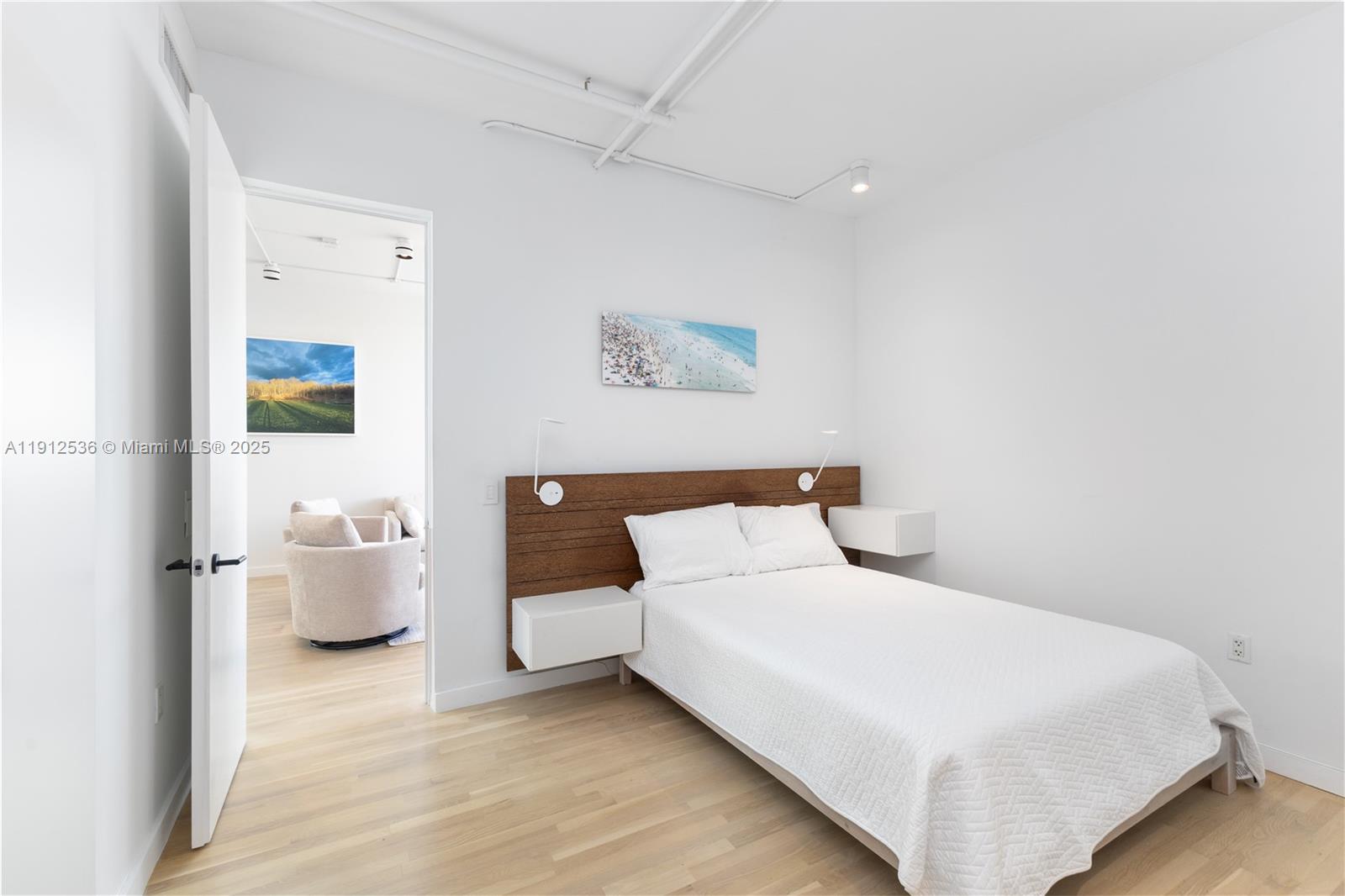 1700 Meridian Avenue, Unit 406 Miami Beach, FL 33139 - Photo 12 of 39 a bedroom with a bed and couch