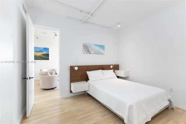 a bedroom with a bed and couch