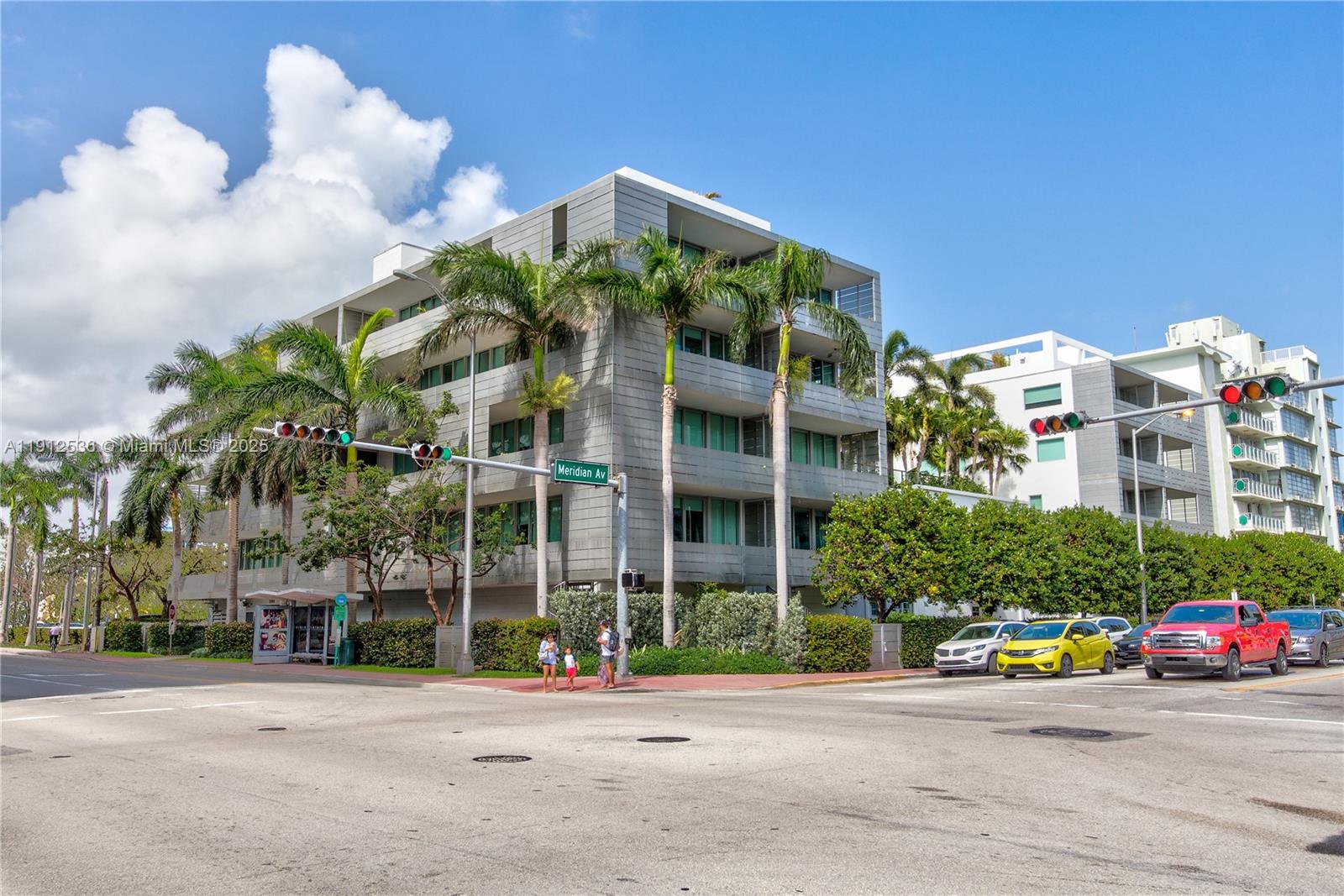 1700 Meridian Avenue, Unit 406 Miami Beach, FL 33139 - Photo 22 of 39 a front view of a building with cars
