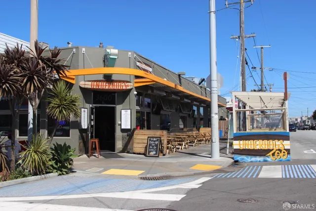 a group of people riding bikes down a street