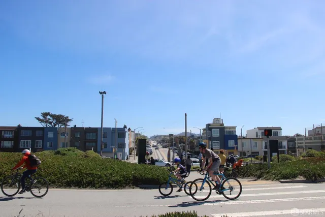 a view of a building with car parked