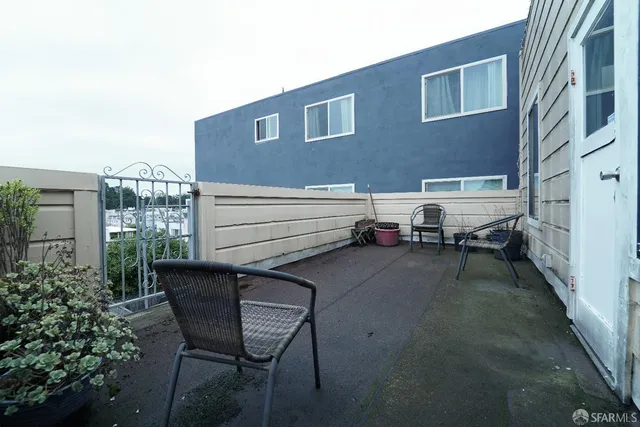 a view of backyard with seating space