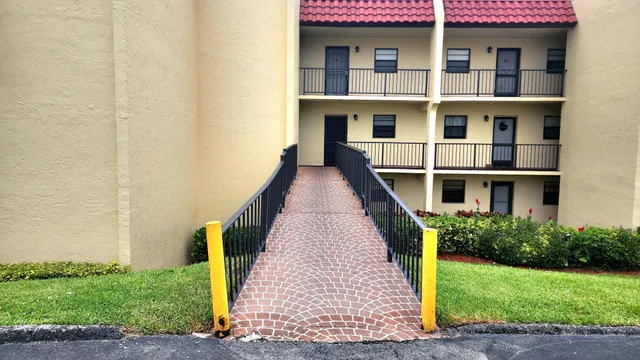 a view of a brick building with many windows