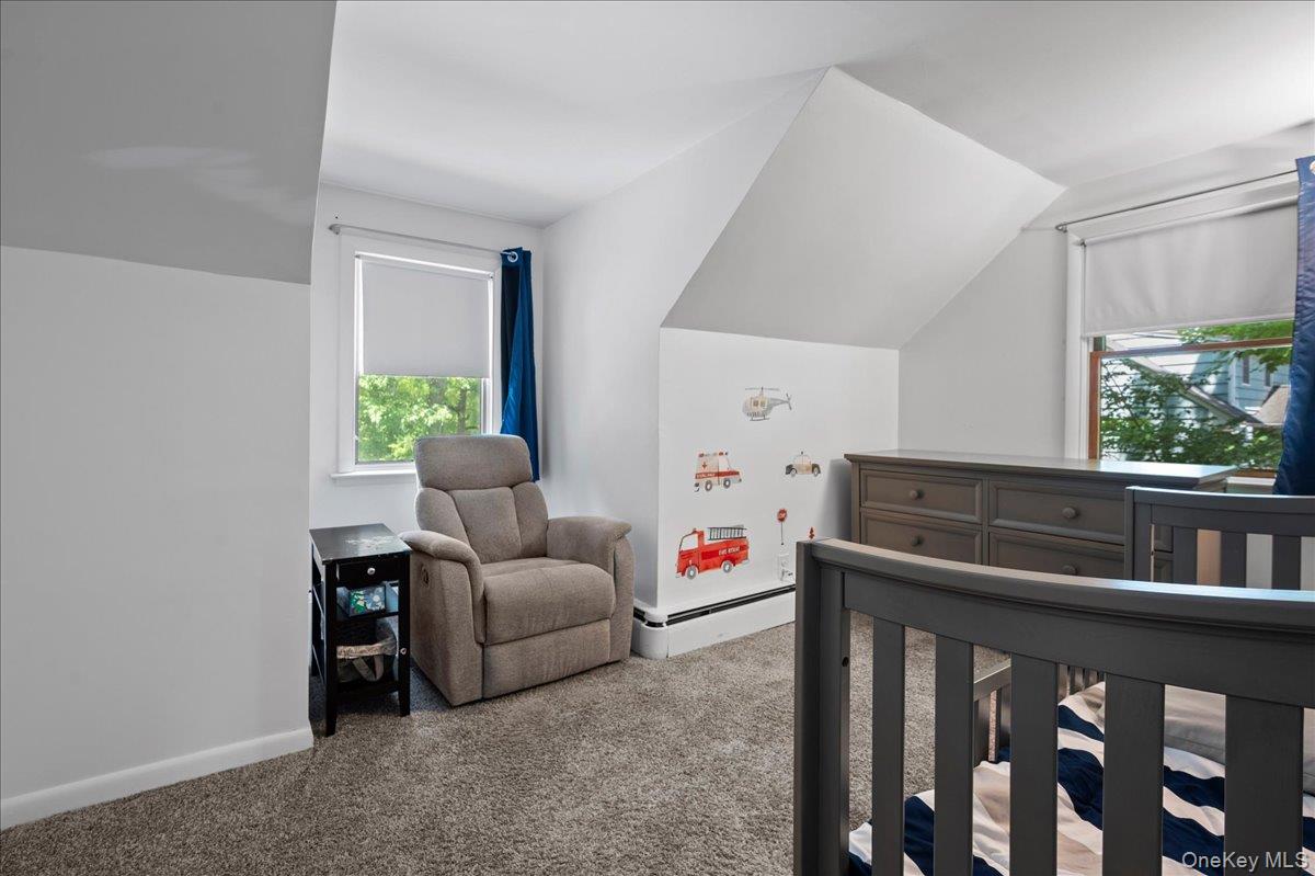 105 High St Extension Mount Kisco, NY 10549 - Photo 29 of 38 a living room with furniture and a window