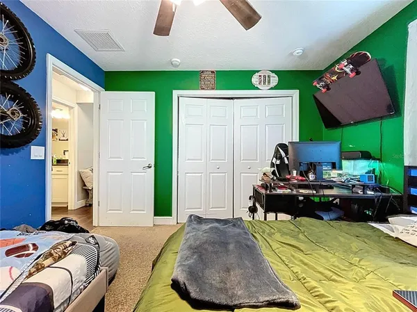 a bedroom with furniture and a wooden floor