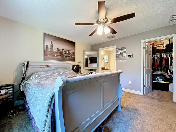 a bed room with a bed and a window