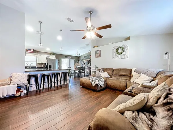 a kitchen with stainless steel appliances granite countertop a stove and cabinets
